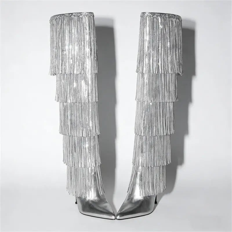 Silver fringe boots on a light gray background