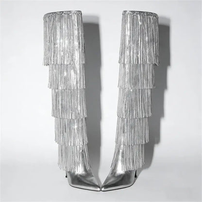 Silver fringe boots on a light gray background