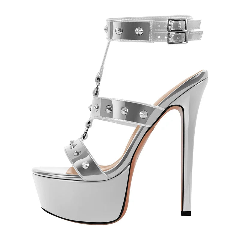 Silver high-heeled shoe with platform and straps on a white background