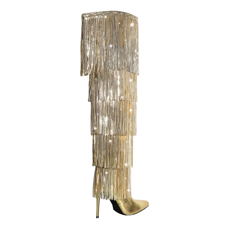 Gold fringed boot with a white background
