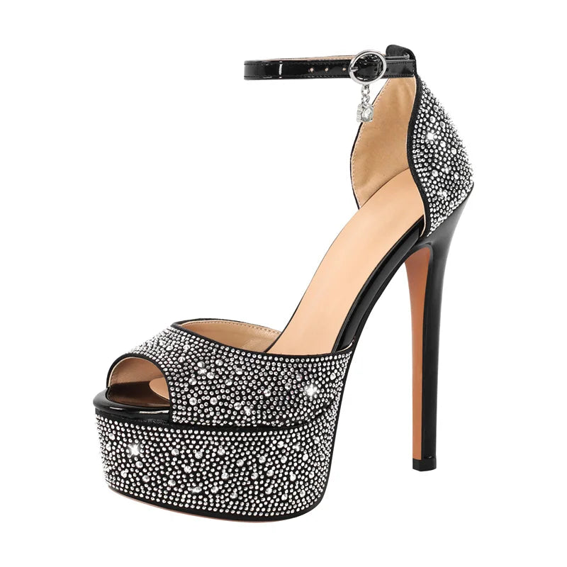 Black high-heeled shoe with crystal embellishments on a white background