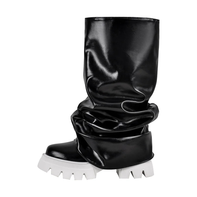 Black glossy knee-high boot with white sole on a white background
