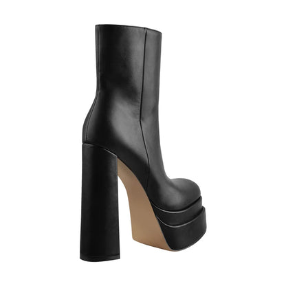 Black platform boot on a white background