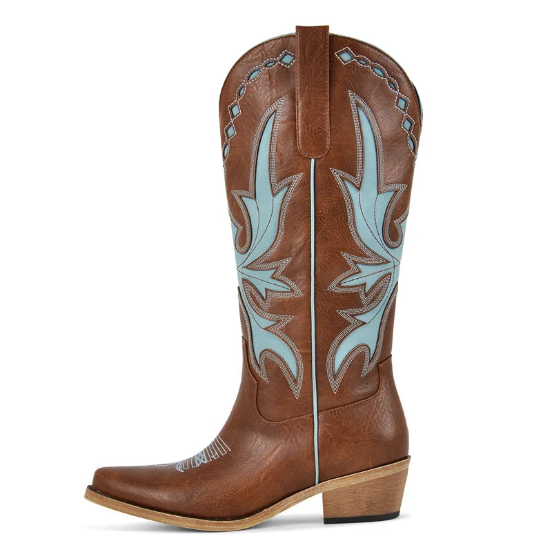 Brown cowboy boot with blue stitching on a white background