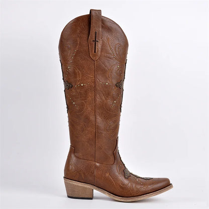 Brown cowboy boot with intricate designs on a white background