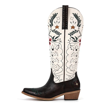 Black and white cowboy boot with floral patterns on a white background