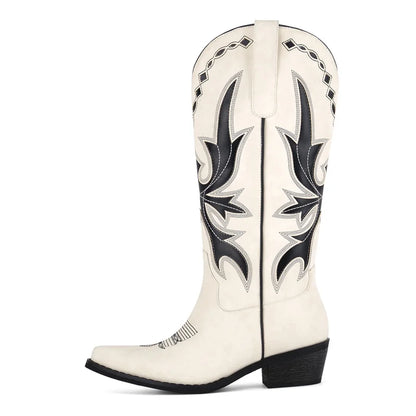 White cowboy boot with black decorative patterns on a white background