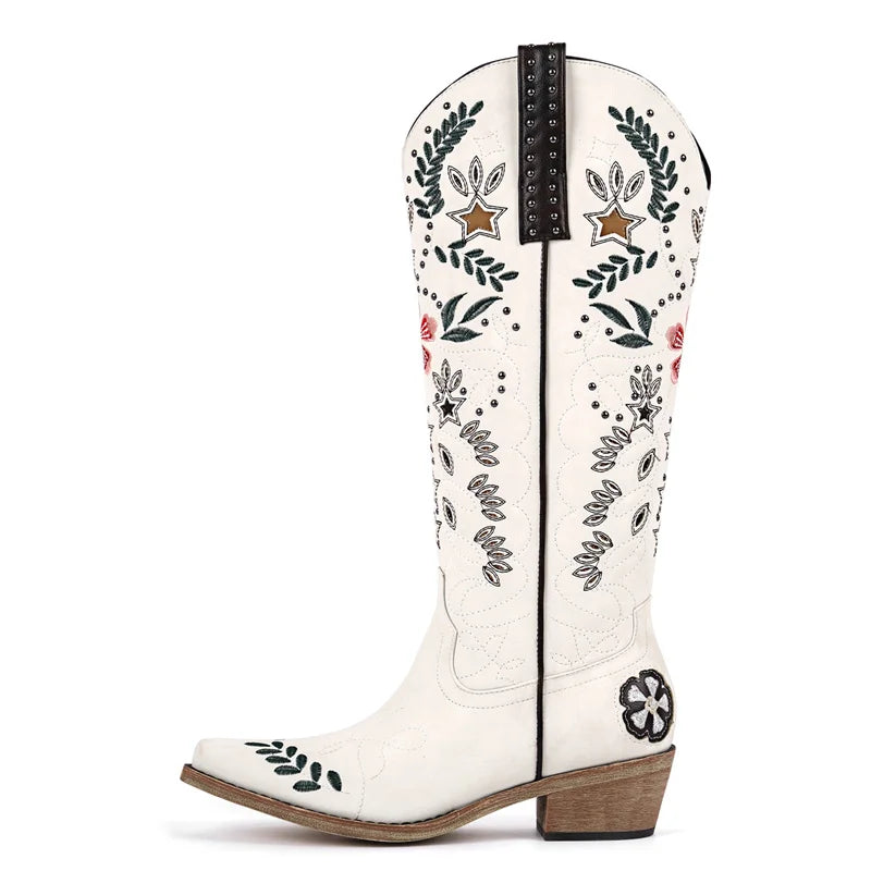 White cowboy boot with floral embroidery on a white background