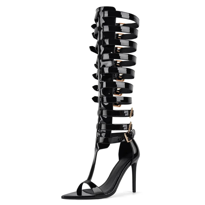 Black high-heeled sandals with multiple straps on a white background