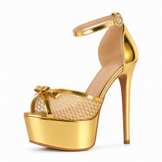 Gold high-heeled shoe with platform on a white background