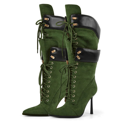 Green high-heeled boots with black accents on a white background