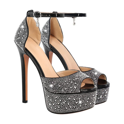 Black high-heeled platform shoes with crystal embellishments on a white background