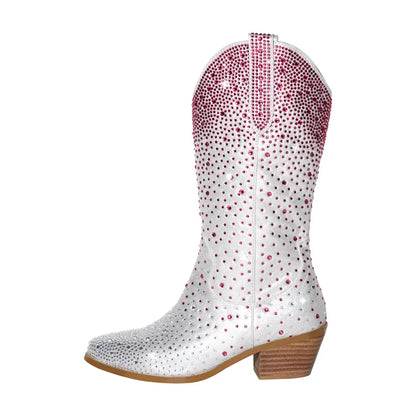 White cowboy boot with pink rhinestone details on a white background