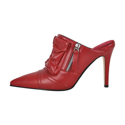 Red high-heeled shoe with a bow and zipper on a white background