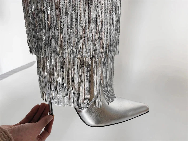 Silver fringe boot on a white background