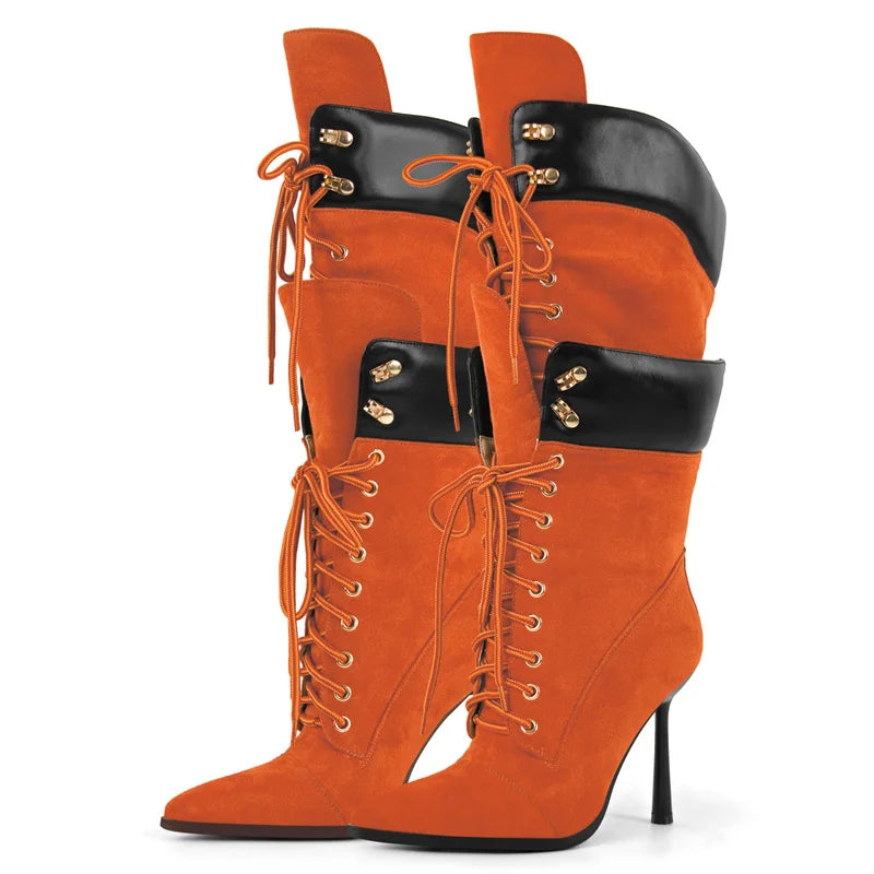 Orange high-heeled boots with black accents on a white background