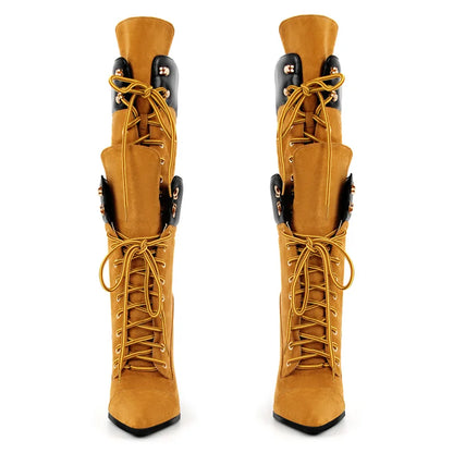 Pair of tan knee-high boots with black accents on a white background