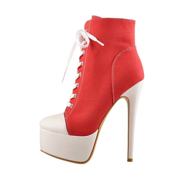 A pair of men's high heels with a lace-up closure, featuring a black leather upper, a white sole, and a stiletto heel design.